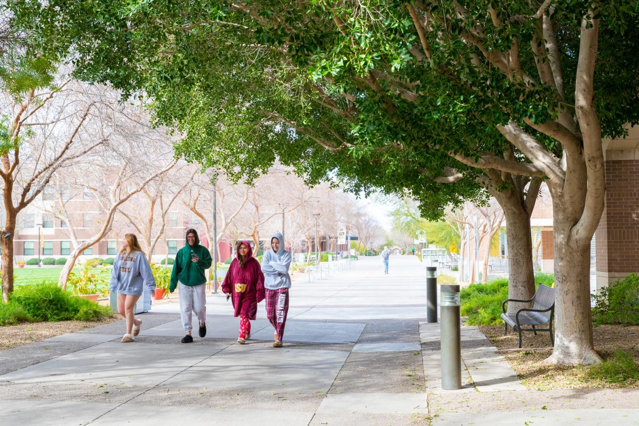 A group of first-year ASU students walks together on the West ASU Campus in Glendale on Feb. 22, 2023.