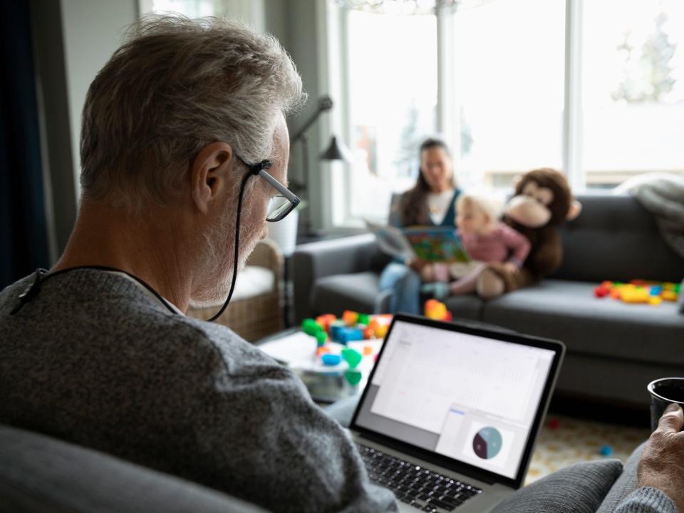 man looking at computer investing