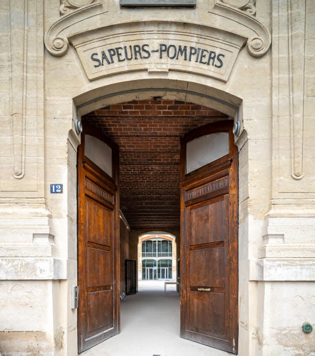 The entrance to La Caserne, which bears traces of the building's past life as a fire station.<p>Photo: Nicolas Thouvenin/Courtesy of La Caserne</p>