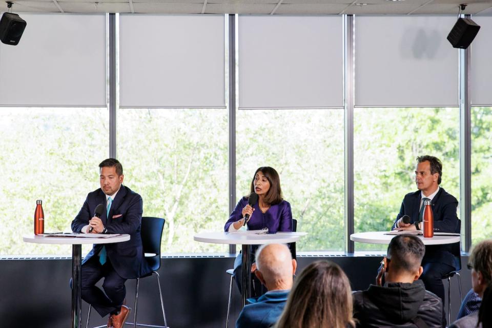 Mississauga mayoral candidates Dipika Damerla, centre, Stephen Dasko, right, and Alvin Tedjo, left, take part in a live debate hosted by the CBC’s David Common, at the Living Arts Centre, on May 30, 2024.