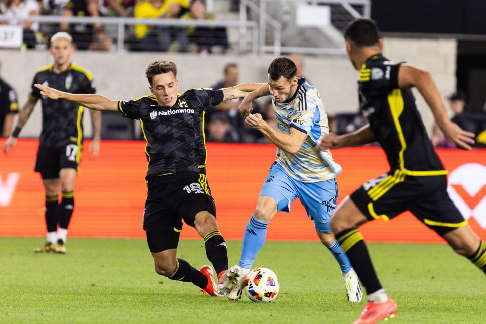 Oct 5, 2024; Columbus, Ohio, USA; Philadelphia Union midfielder Daniel Gazdag (10) dribbles the ball while Columbus Crew defender Malte Amundsen (18) defends in the second half at Lower.com Field. Mandatory Credit: Trevor Ruszkowski-Imagn Images