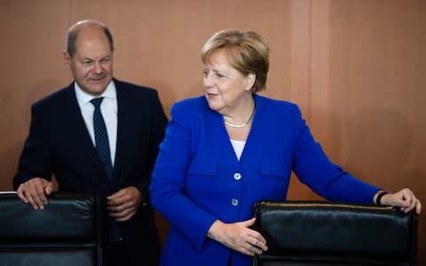 Merkel Scholz - Credit: &nbsp;CLEMENS BILAN/EPA-EFE/REX