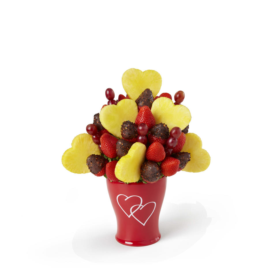 Indulge in some strawberries and turn up the heat.  (Edible Arrangements)