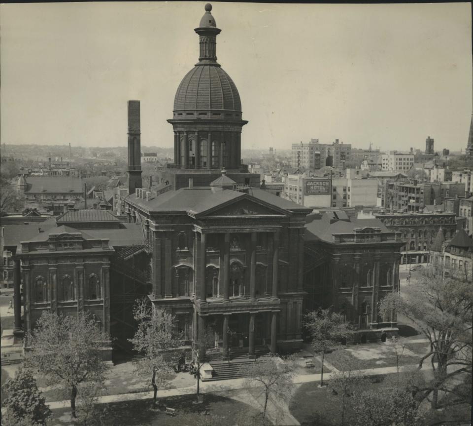 The Milwaukee County Courthouse, in what is now Cathedral Square Park, is shown shortly before it was torn down in 1939. The courthouse was the site of the 1924 trial of the lawsuit filed by "Shoeless" Joe Jackson against his former employer, the Chicago White Sox.