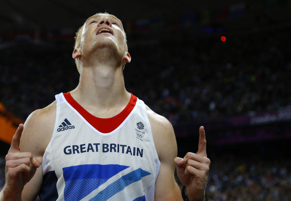 Britain's Greg Rutherford reacts after winning the gold in the men's long jump final at the London 2012 Olympic Games at the Olympic Stadium August 4, 2012. REUTERS/Phil Noble (BRITAIN - Tags: OLYMPICS SPORT ATHLETICS TPX IMAGES OF THE DAY) 