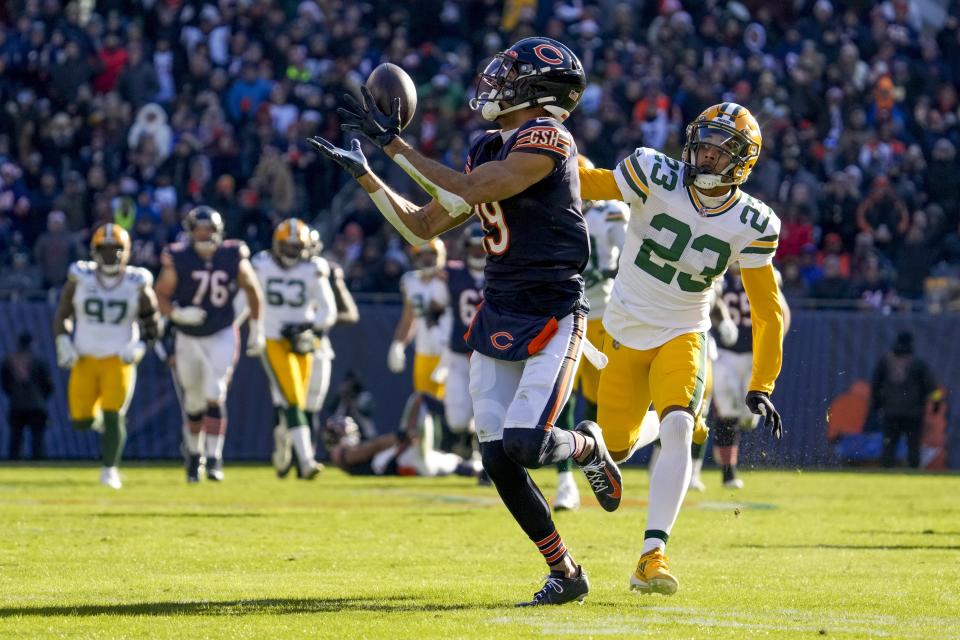 Chicago Bears' Equanimeous St. Brown catches a long pass in front of Green Bay Packers' Jaire Alexander during the first half of an NFL football game Sunday, Dec. 4, 2022, in Chicago. (AP Photo/Nam Y. Huh)