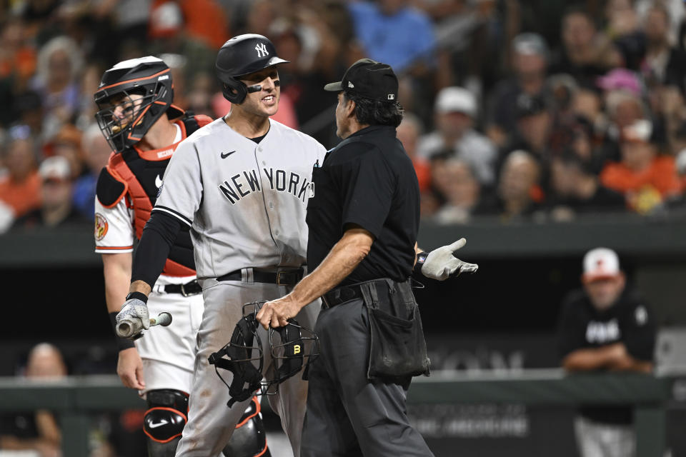 New York Yankees Anthony Rizzo argues a called third strike with home plate umpire Phil Cuzzi in the fifth inning of a baseball game Sunday, July 30, 2023, in Baltimore. The Orioles won 9-3. (AP Photo/Gail Burton)