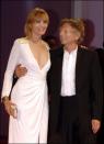 <p>Emmanuelle Seigner: 5' 8"<br>Roman Polanski: 5' 5"<br></p>