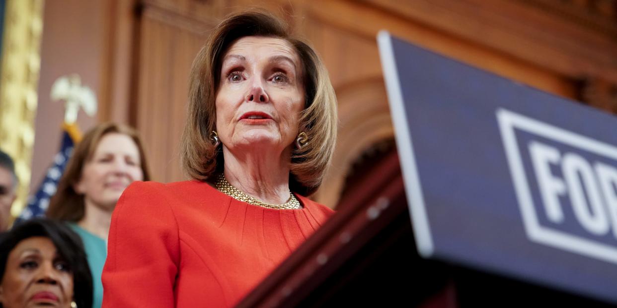 FILE PHOTO: Speaker of the House Nancy Pelosi, joined by fellow Democrats, speaks during a news conference about legislation the House has passed at the Capitol in Washington, U.S., December 19, 2019. REUTERS/Erin Scott