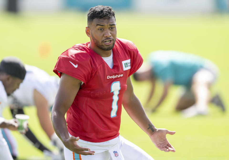 MIAMI GARDENS, FL - AUGUST 06: Miami Dolphins quarterback Tua Tagovailoa (1) gestures on the field during a practice session at the Miami Dolphins training camp at Baptist Health Training Complex on August 6, 2022 in Miami Gardens, Florida.  (Photo by Doug Murray/Icon Sportswire via Getty Images)