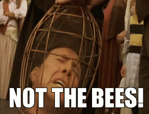 Nicolas Cage with his head in a cage, yelling, "Not the bees!"