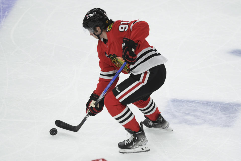 Chicago Blackhawks' Frank Nazar moves the puck before scoring during the first period of an NHL hockey game against the Carolina Hurricanes, Sunday, April 14, 2024, in Chicago. (AP Photo/Paul Beaty)