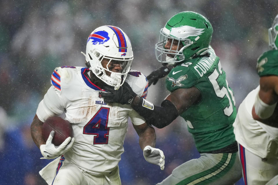 Buffalo Bills running back James Cook is tackled by Philadelphia Eagles linebacker Zach Cunningham during the first half of an NFL football game Sunday, Nov. 26, 2023, in Philadelphia. (AP Photo/Matt Slocum)