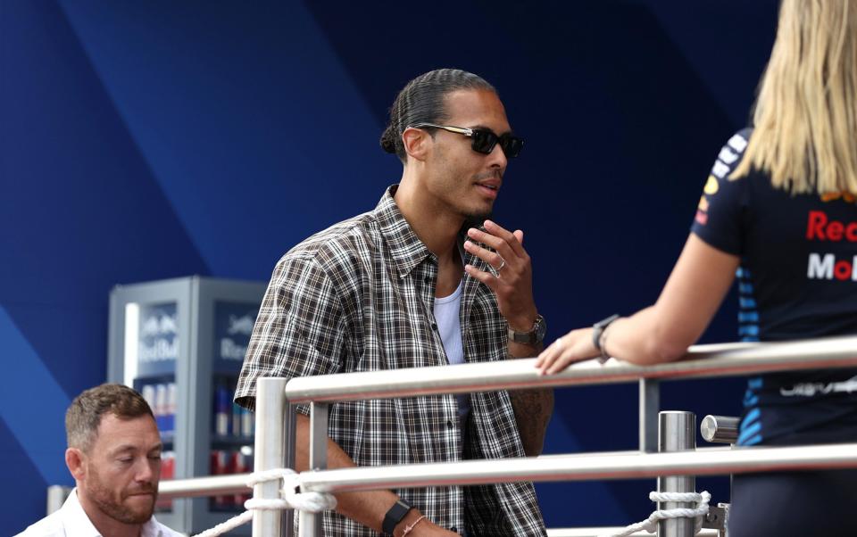 Virgil van Dijk arrives at the Red Bull motorhome