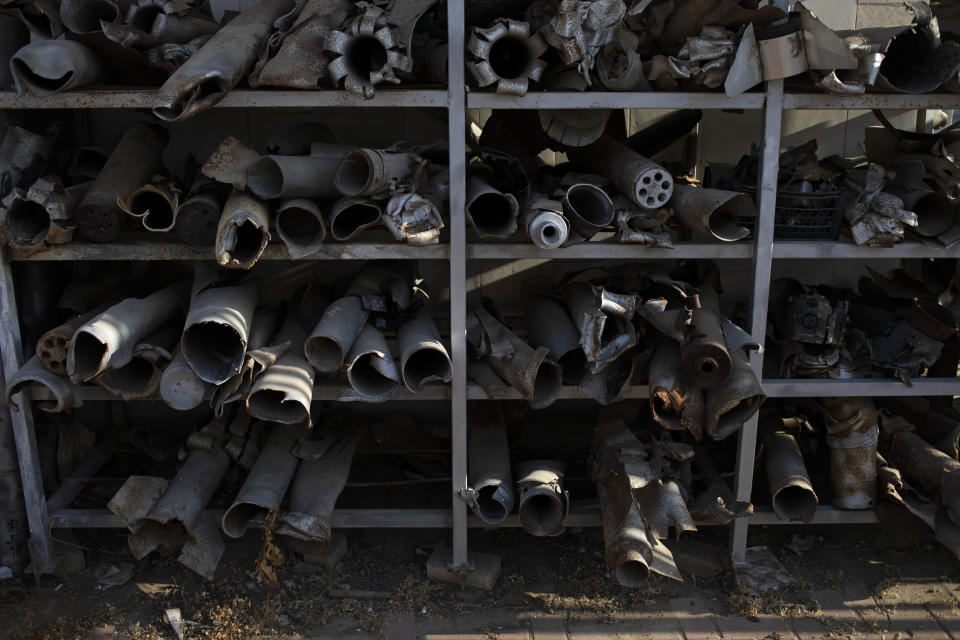 Remains of rockets, fired from the Gaza Strip which have landed in southern Israel, are displayed at the police station in Sderot, Israel, Tuesday, July 20, 2021. No place in Israel has been hit harder by Palestinian rocket fire than Sderot, a working-class town just about a mile (1.5 kilometers) from the Gaza border. Although Sderot is enjoying an economic boom and revival, a generation of children and parents are suffering from the traumatic effects of two decades of rocket fire that experts are still struggling to understand. (AP Photo/Ariel Schalit)