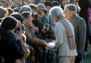 Royal aficionado Fumiko Shirataki, 78, shakes hands with Japan's Empress Michiko near an imperial villa where Japan's Emperor Akihito and Empress Michiko are staying for their recuperation in Hayama town, south of Tokyo, Japan, January 21, 2019. REUTERS/Issei Kato