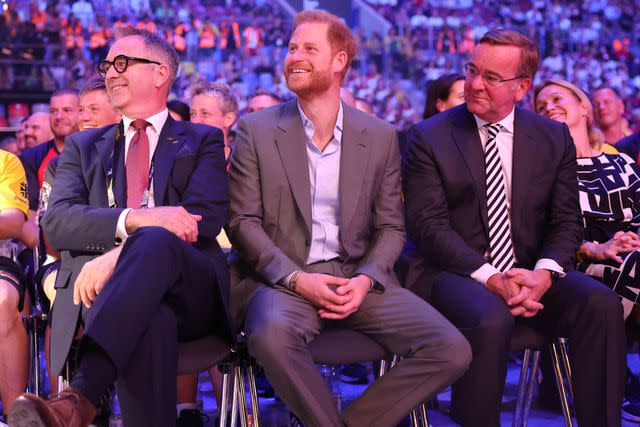 <p>Chris Jackson/Getty for the Invictus Games Foundation</p> Prince Harry sits with Dominic Reid and Boris Pistorius at the Invictus Games in Germany