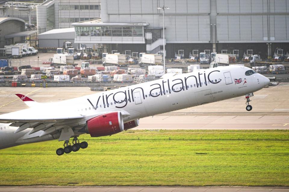 Virgin Atlantic flight VS3 performs a synchronised departure with British Airways flight BA001 on parallel runways at Heathrow Airport, heading for New York JFK (Doug Peters/PA) (PA Wire)