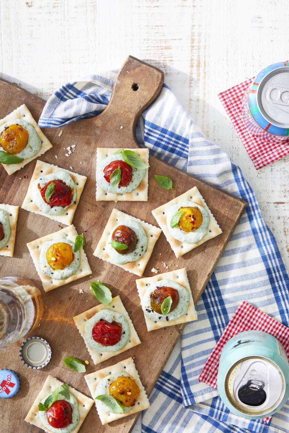 saltines with basil mayo and burst tomatoes