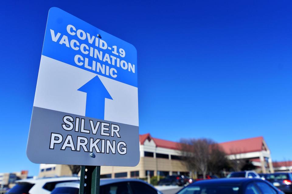 Signs direct drivers where to park for the COVID-19 vaccination clinic at Robinwood Professional Center on Thursday, Jan. 7, 2021.