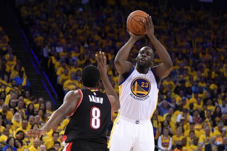 Golden State Warriors forward Draymond Green (23) shoots the basketball against Portland Trail Blazers forward Al-Farouq Aminu (8) during the third quarter in game two of the second round of the NBA Playoffs at Oracle Arena. The Warriors defeated the Trail Blazers 110-99. Mandatory Credit: Kyle Terada-USA TODAY Sports