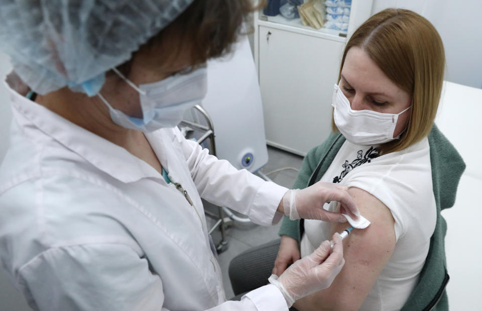 MOSCOW, RUSSIA  APRIL 14, 2021: A woman receives an injection of the Gam-COVID-Vac vaccine (under the brand name of Sputnik V) at a mobile COVID-19 vaccination site at the Arena Plaza shopping mall; the vaccine is provided free of charge and without prior sign-up. Mikhail Tereshchenko/TASS (Photo by Mikhail Tereshchenko\TASS via Getty Images)