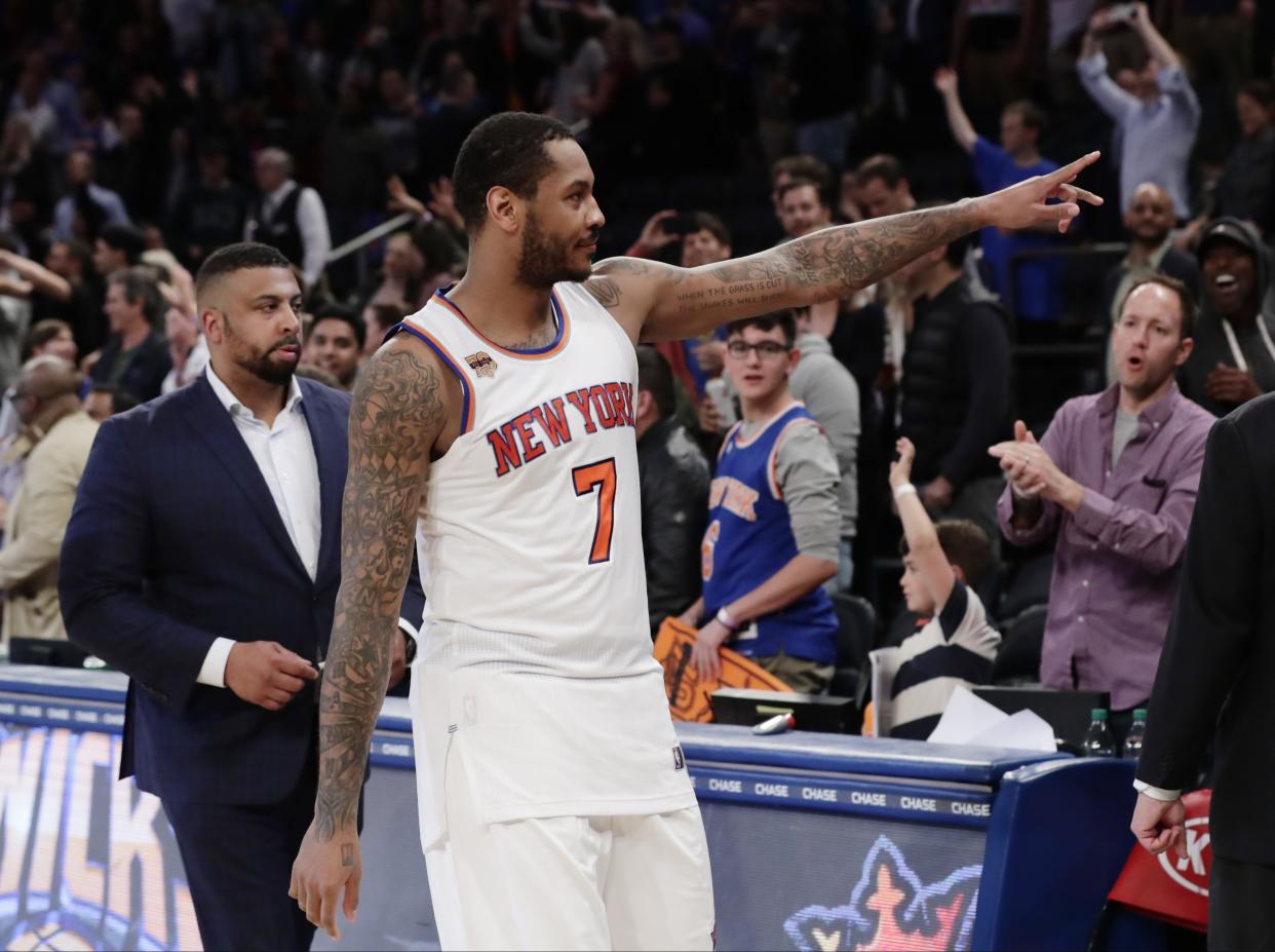 Carmelo Anthony gestures to New York fans after what turned out to be his final game in a Knicks uniform. (AP)