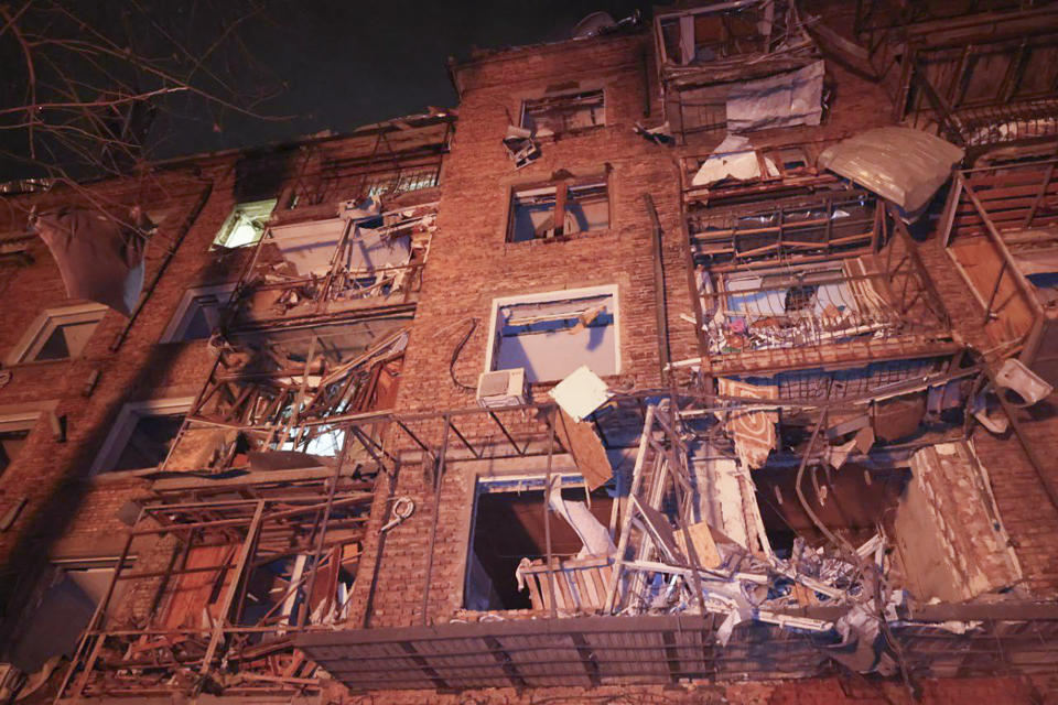 In this photo provided by the Ukrainian Emergency Service, an apartment building hit by a Russian missile is seen in Kharkiv, Ukraine, Saturday, Dec. 30, 2023. (Ukrainian Emergency Service via AP)