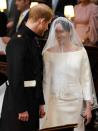 <p>Dressed in Givenchy, Meghan Markle looked a timeless beauty as she gazed into her husband Prince Harry's eyes as they said 'I do' at the royal wedding, May 2018</p>