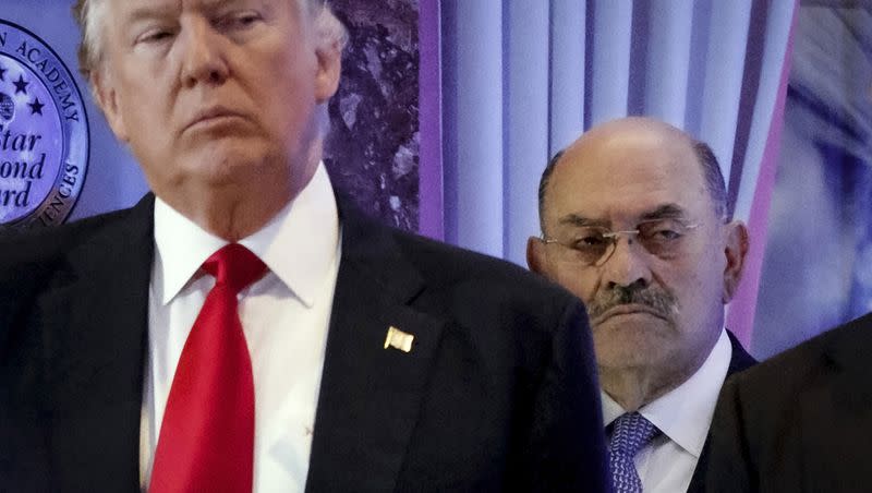 Allen Weisselberg, right, stands behind then President-elect Donald Trump during a news conference in the lobby of Trump Tower in New York, Jan. 11, 2017. A New York judge ruled Friday, Feb. 16, 2024, against Trump, imposing a $364 million penalty over what the judge ruled was a yearslong scheme to dupe banks and others with financial statements that inflated the former president’s wealth.