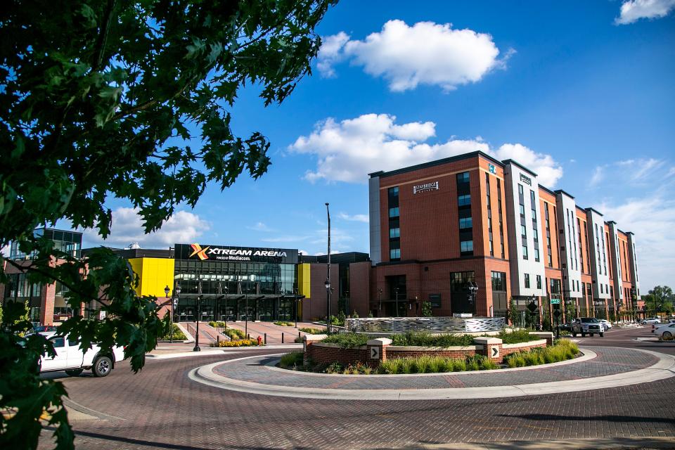 A general view of the exterior of the Xtream Arena and Staybridge Suites hotel is seen, Tuesday, Aug. 17, 2021, at the Iowa River Landing in Coralville, Iowa.