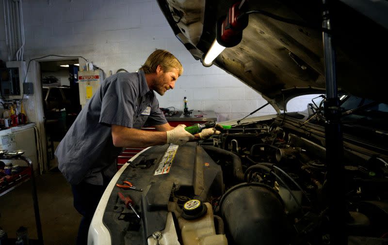 FILE PHOTO: Mechanic Donnie Asher works on a car at Corner Mechanic in Golden