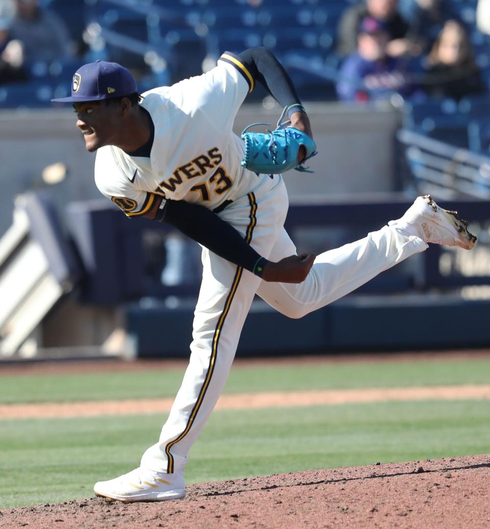 Milwaukee Brewers reliever Abner Uribe follows through on a pitch against the Texas Rangers on March 2.