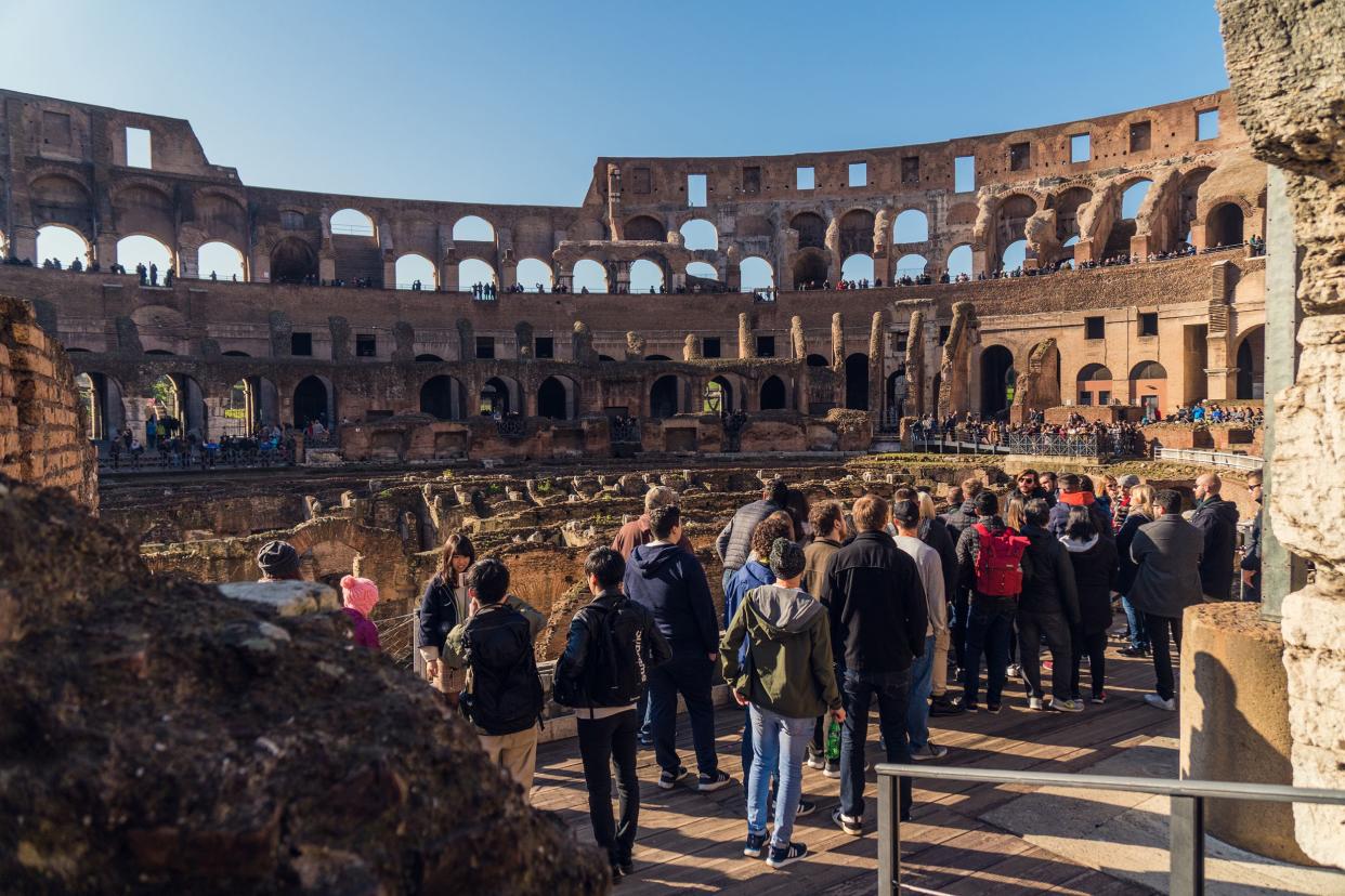 people visiting Colosseum