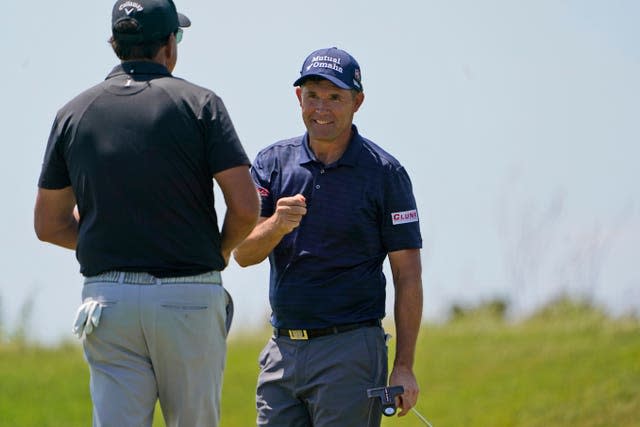 Padraig Harrington, right, was playing alongside Phil Mickelson 