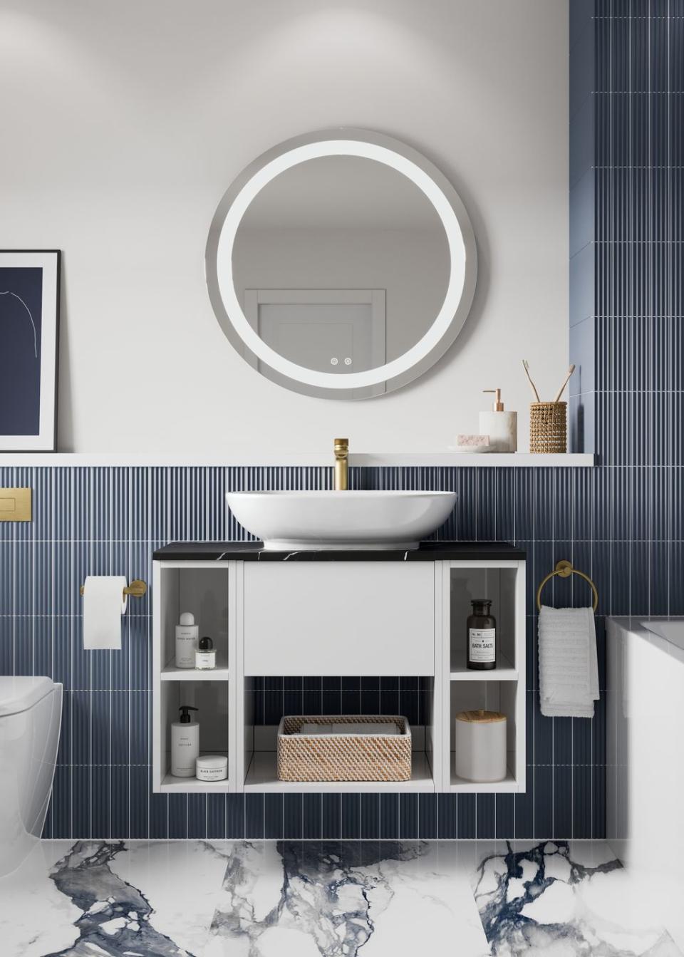 a white wall mounted sink cabinet with bathroom shelving in a blue tiled room