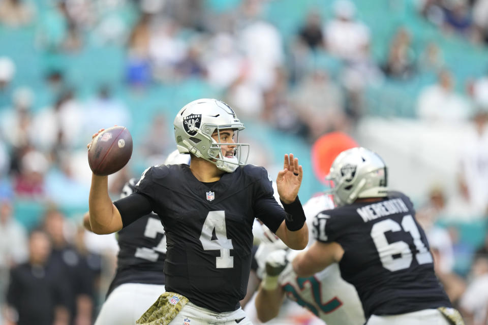 Las Vegas Raiders quarterback Aidan O'Connell (4) aims a pass during the second half of an NFL football game against the Miami Dolphins, Sunday, Nov. 19, 2023, in Miami Gardens, Fla. (AP Photo/Rebecca Blackwell)