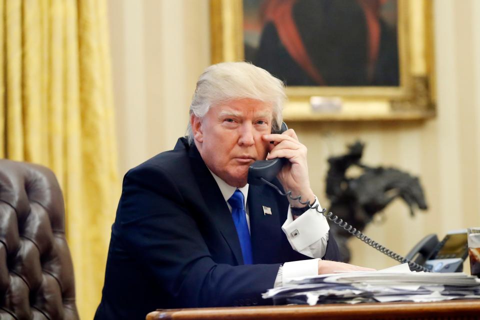 In this Jan. 28, 2017, file photo, U.S. President Donald Trump speaks on the phone with Prime Minister of Australia Malcolm Turnbull in the Oval Office of the White House in Washington.