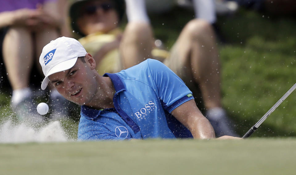 Martin Kaymer, of Germany, hits from a ninth hole bunker during the third round of The Players championship golf tournament at TPC Sawgrass, Saturday, May 10, 2014, in Ponte Vedra Beach, Fla. (AP Photo/Gerald Herbert)