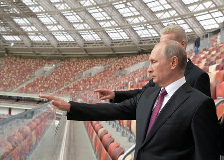 FILE PHOTO: Russian President Vladimir Putin listens to Moscow Mayor Sergei Sobyanin as they inspect the Luzhniki Stadium, which will host matches of the 2018 FIFA World Cup, in Moscow, Russia September 9, 2017. Sputnik/Alexei Druzhinin/Kremlin via REUTERS/File Photo