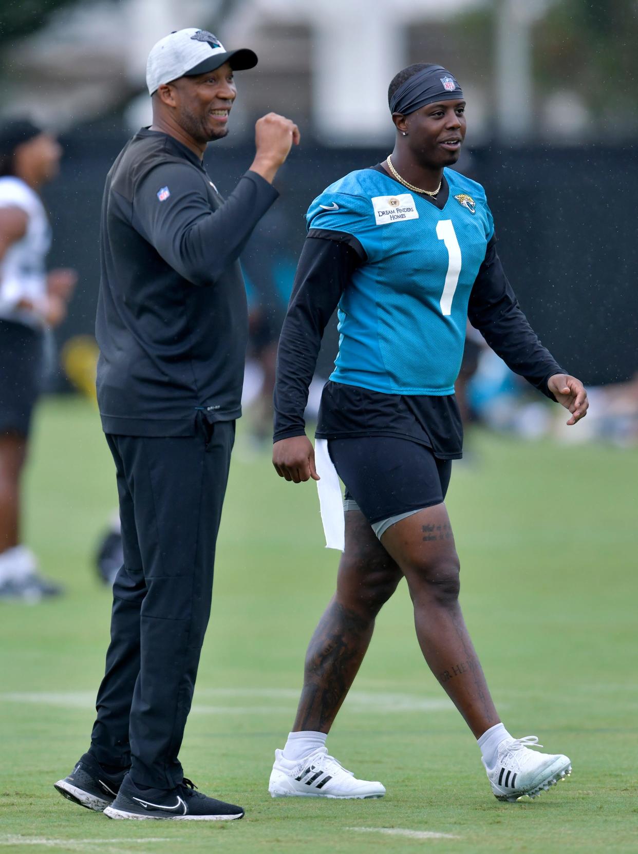 Jacksonville Jaguars running back Travis Etienne Jr. (1) works with Running Backs Coach Bernie Parmalee during the Jacksonville Jaguars Friday morning training camp session July 28, 2023 inside the Miller Electric Center training facility. [Bob Self/Florida Times-Union]