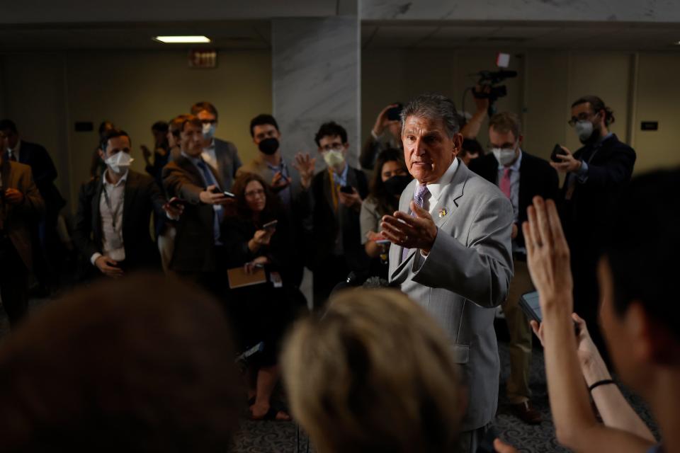 Sen. Joe Manchin, D-W.Va., speaks to reporters outside of his Washington office in August 2022.