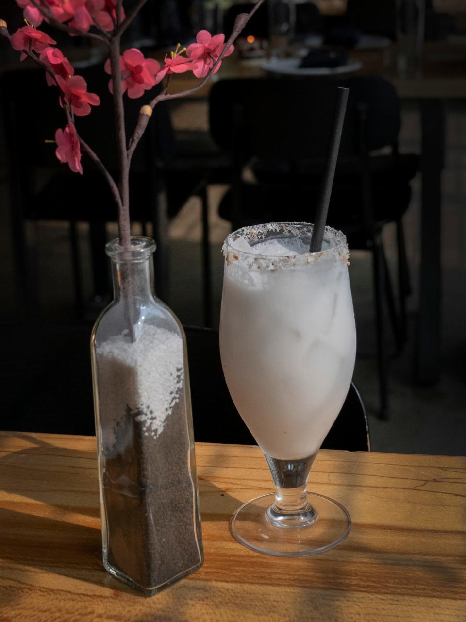 A zero-proof House Coconut Lemongrass Iced Tea is on the menu at Vigilante Kitchen which opened June 30, 2023. This has been the dream of executive chef and owner Aaron Cozadd, who has conceptualized an immersive venue that encompasses Zen vibes, punk rock and graphic novels.