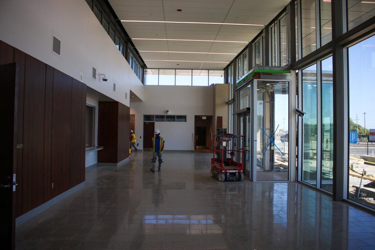 Construction workers convene in the front lobby of the new Saline County Jail Sept. 5.