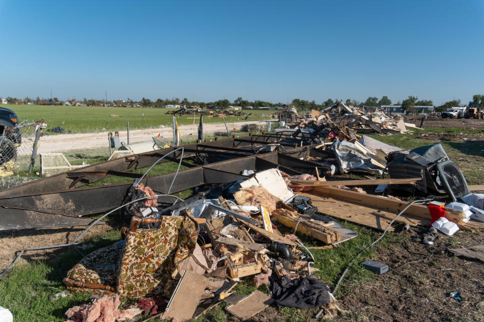 A row of debris is seen in June from the EF-3 tornado in Perryton, which took out about 60 homes in a trailer community west of downtown.