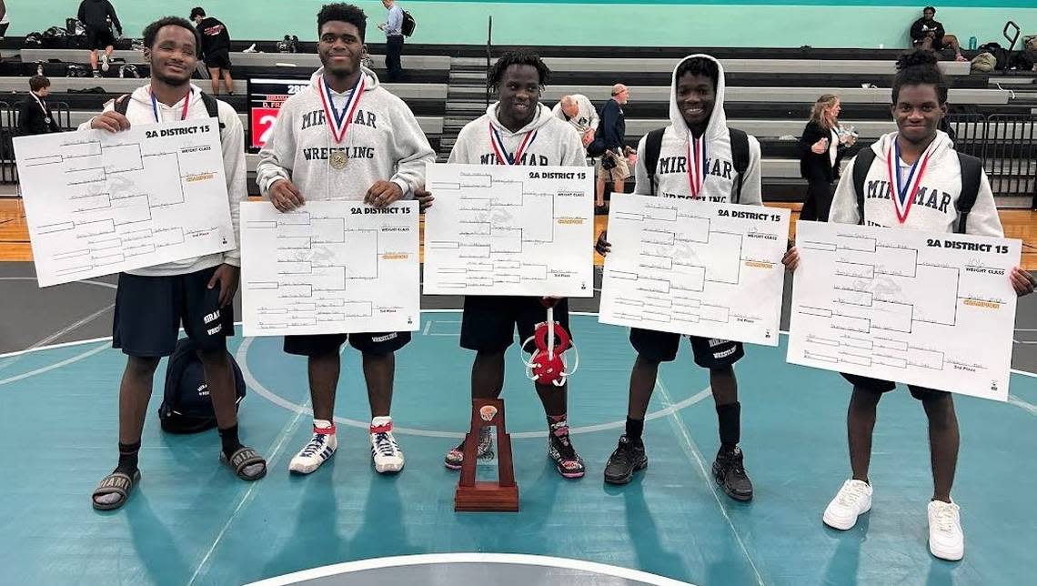 The district champion Miramar wrestling team celebrated five individual district champions.
