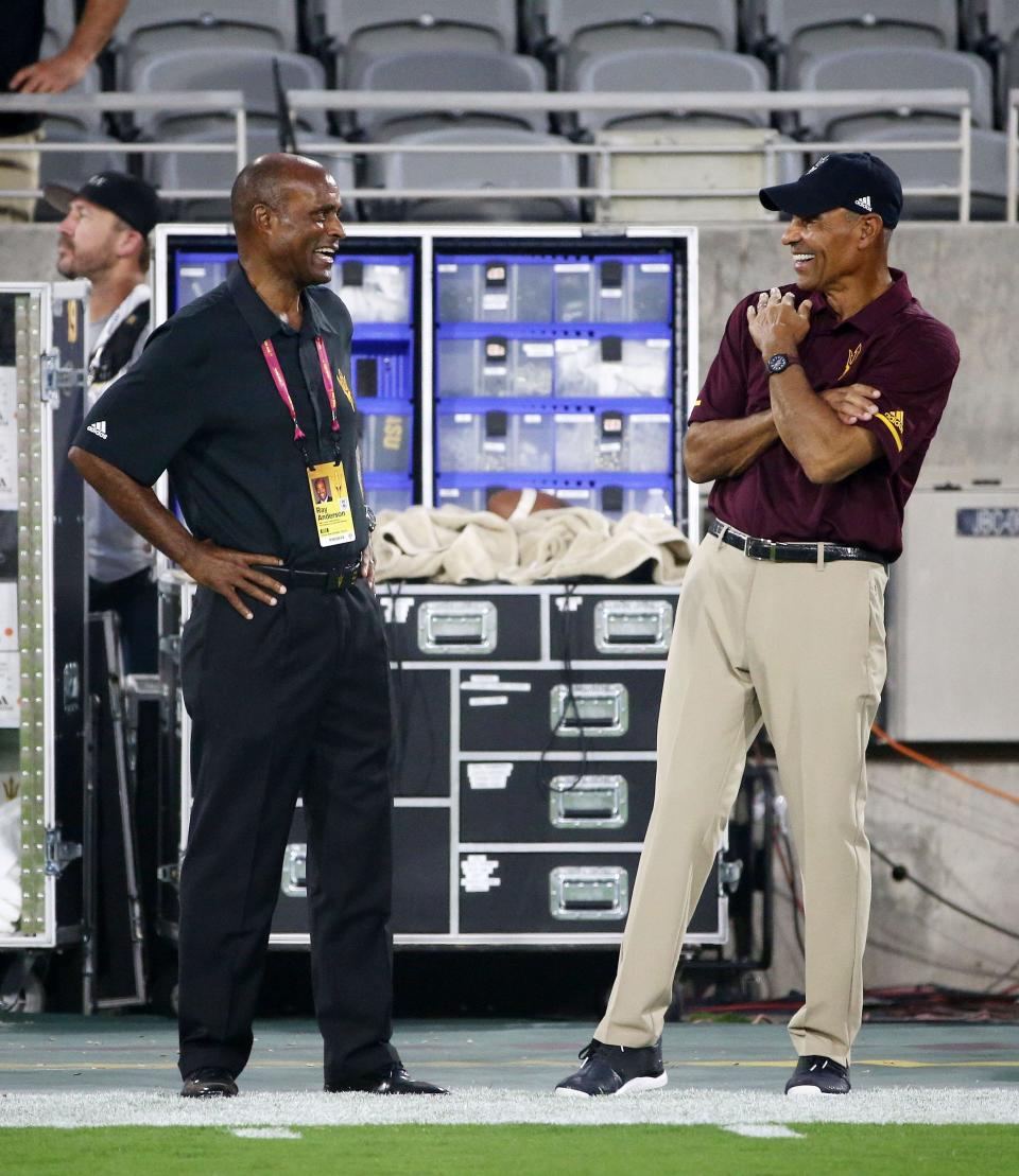 Arizona State AD Ray Anderson talks to head coach Herm Edwards during the pregame warm-up against Michigan State on Sep. 8, 2018, at Sun Devil Stadium.