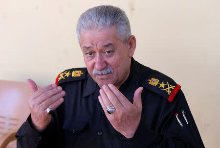 Major General Abdul Ghani al-Asadi, a commander of the Counter Terrorism Service (CTS) speaks with a Reuters reporter at the operations headquarters in western Mosul, Iraq, April 24, 2017. REUTERS/Muhammad Hamed