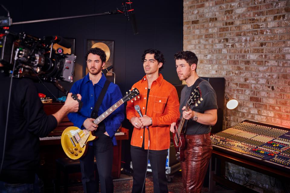 As a part of the band's album release, the Jonas Brothers are premiering performances of two songs plus a "Waffle House" remix in the game Candy Crush Saga.