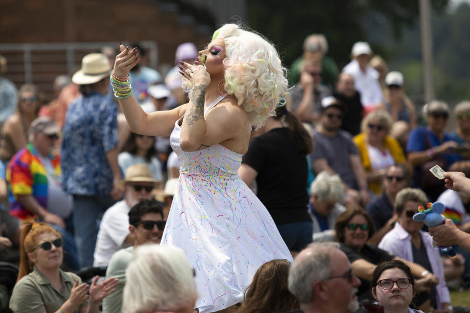 Donna Tella is seen preforming during a drag show at the Lynne Sherwood Waterfront Stadium in Grand Haven, Mich., on Saturday, June 10, 2023. The festival — which organizers had hoped would attract at least 500 attendees — drew thousands of people from all over who came to experience the first-time event's drag show, dance party and vendor-filled streets. (AP Photo/Kristen Norman)